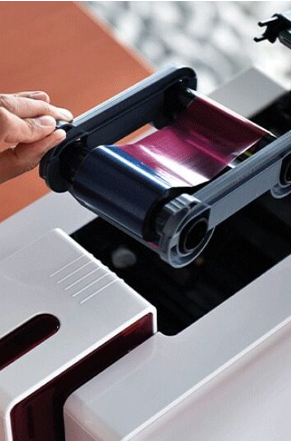Loading a color ribbon into an ID card printer