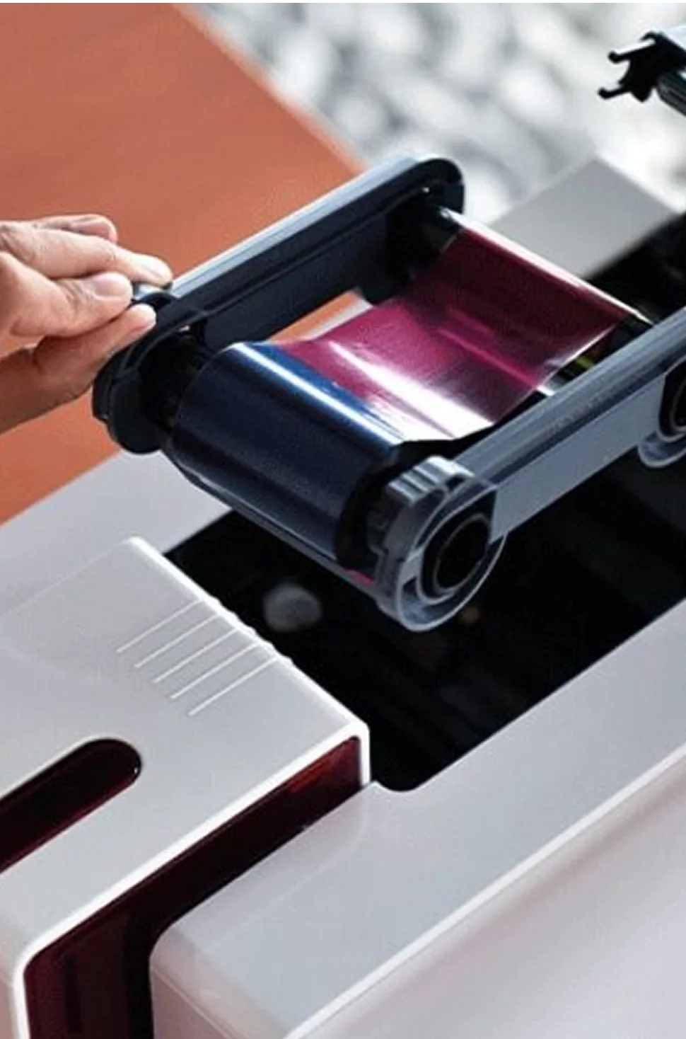 Loading a color ribbon into an ID card printer