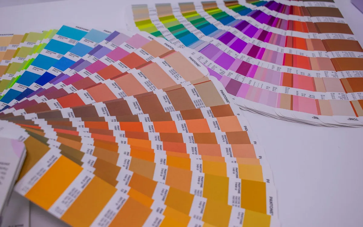 A collection of Pantone color swatches showcasing a wide range of vivid hues for designers.