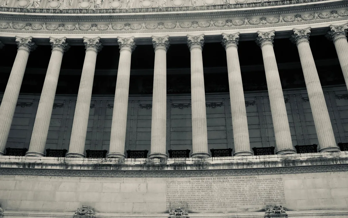 Detailed view of neoclassical columns in a government building facade.